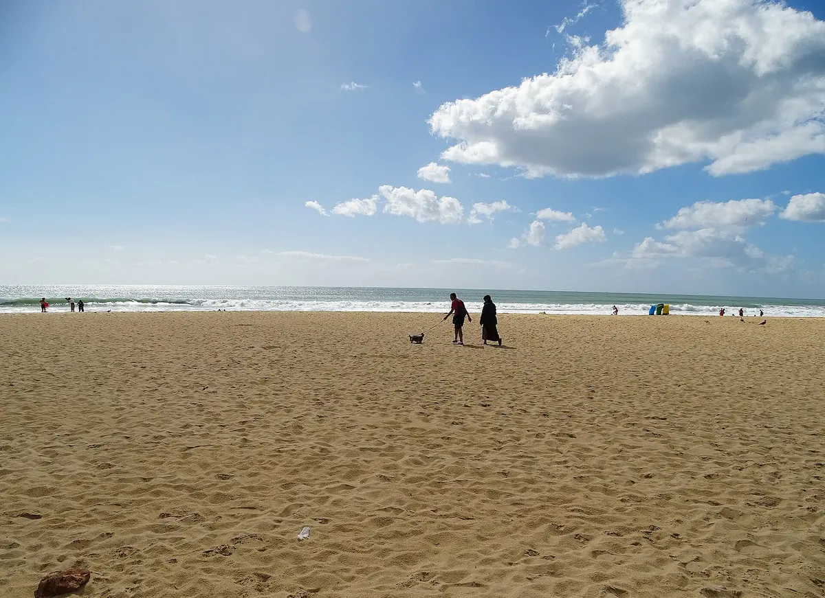 The wide sandy beach and sea at Armação de Pêra