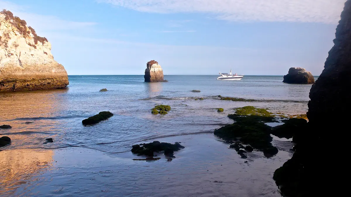 The beach and coastal setting at Praia do Alemão in the western Algarve