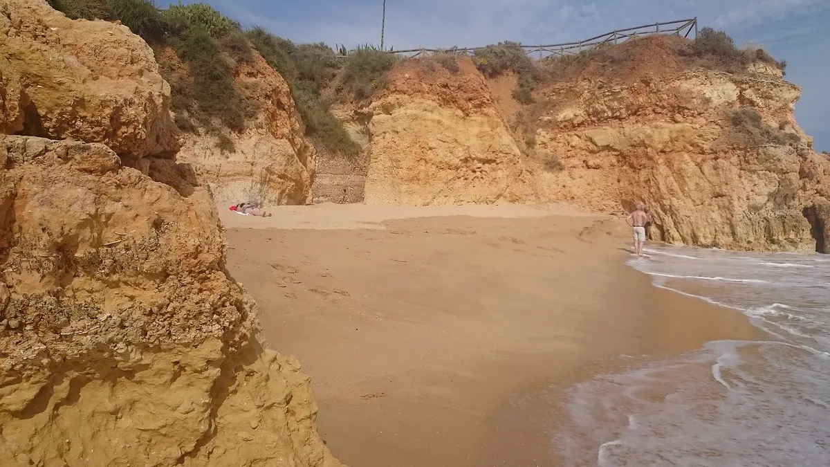 The beach and coastal setting at Praia dos Careanos in the western Algarve