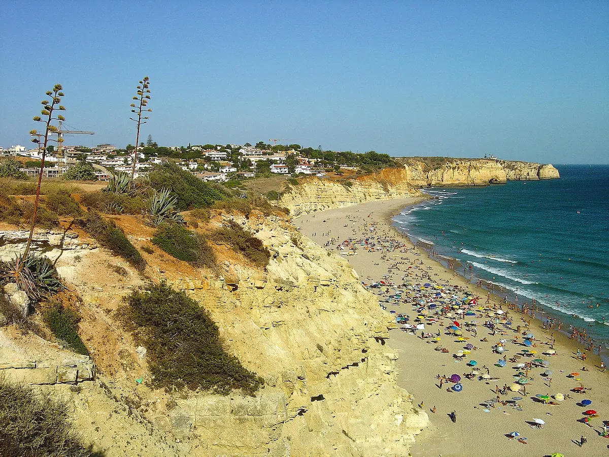 The beach and coastal setting at Praia de Porto de Mós in the western Algarve