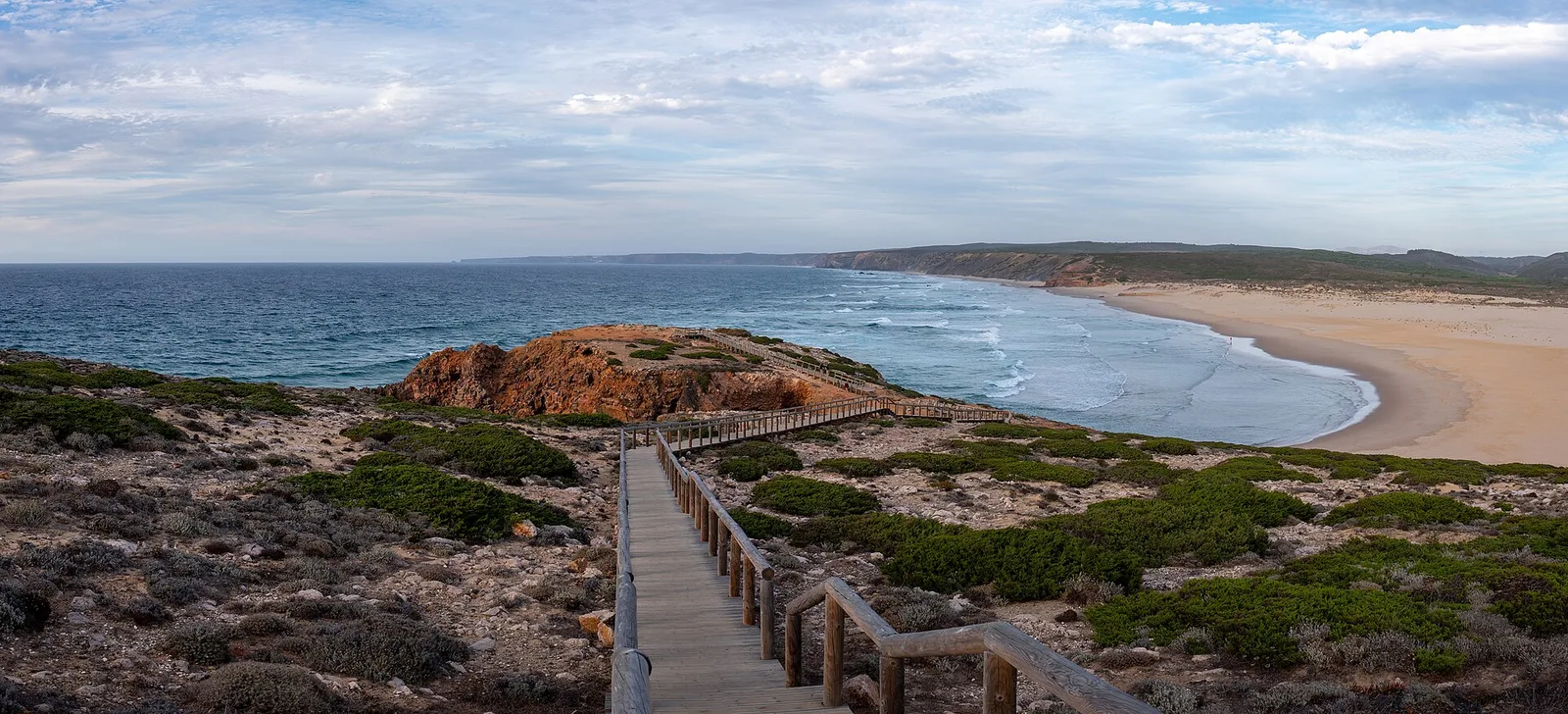 A wooden coastal path above the Atlantic and Bordeira beach near Carrapateira