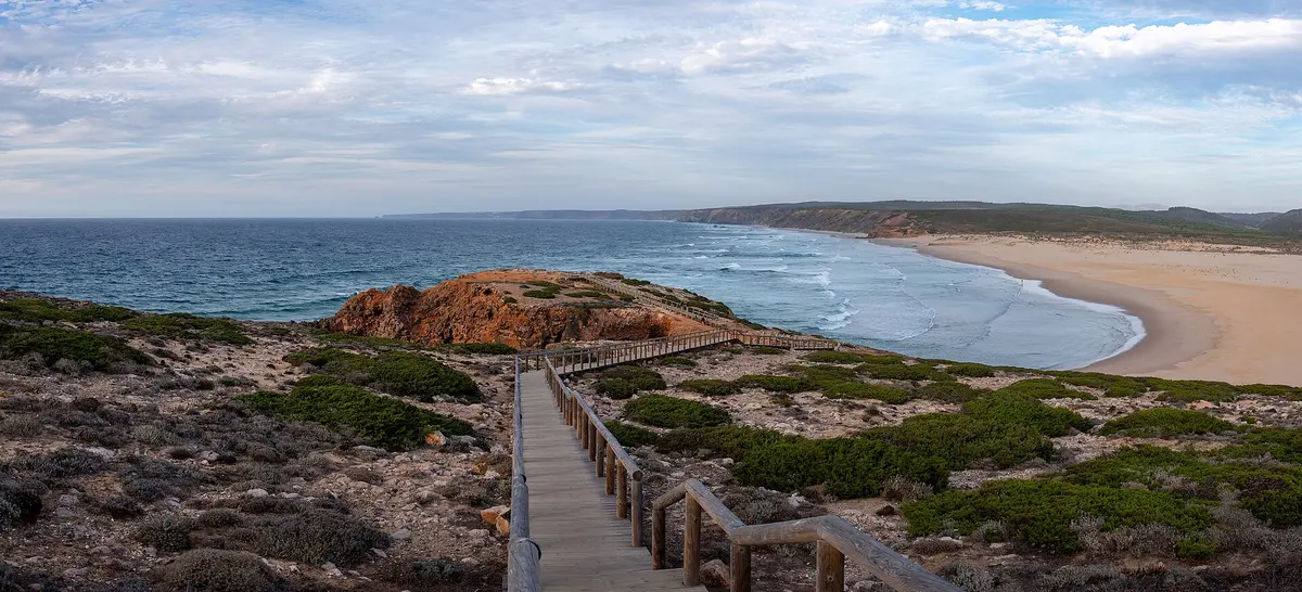 A wooden coastal path above the Atlantic and Bordeira beach near Carrapateira