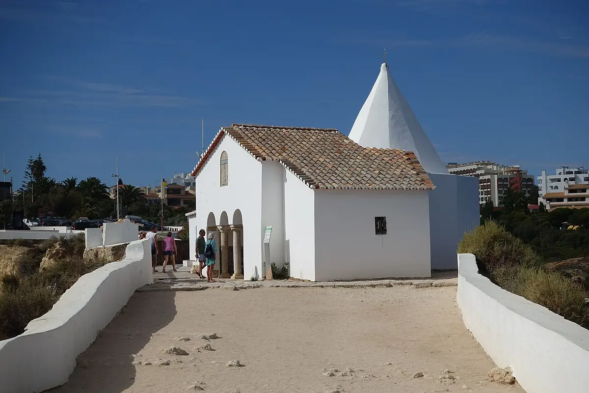 The small white chapel of Nossa Senhora da Rocha on its coastal headland