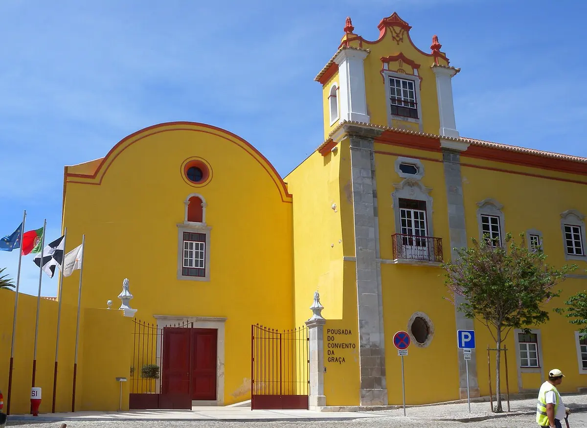 Ochre façade and church front of the former Graça convent in Tavira