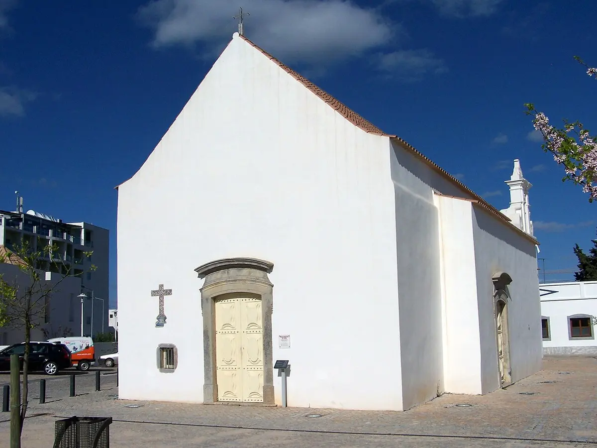 Small white Santa Ana chapel with its plain gable in Tavira