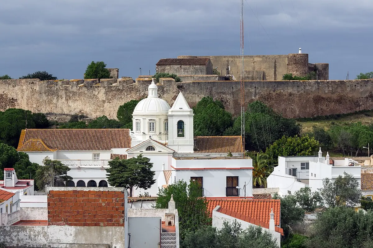 White parish church below the hilltop fortifications of Castro Marim