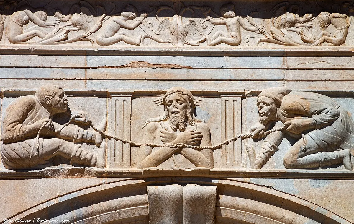 Carved figures above the Renaissance portal of Moncarapacho parish church