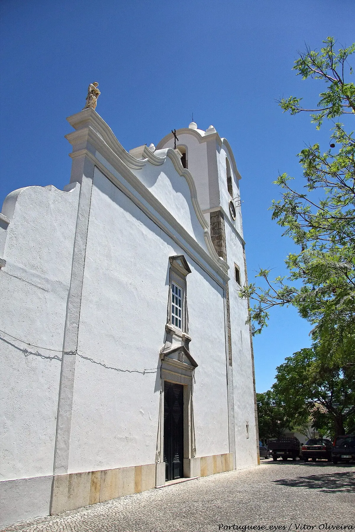 White façade and bell tower of Igreja de Santa Bárbara de Nexe