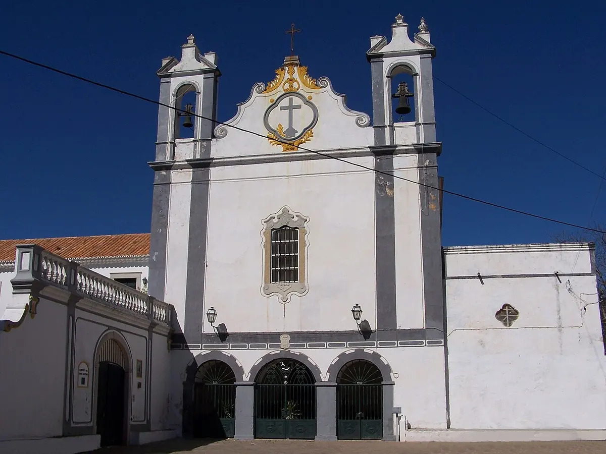 White façade with twin bell towers at Santo António dos Capuchos in Tavira