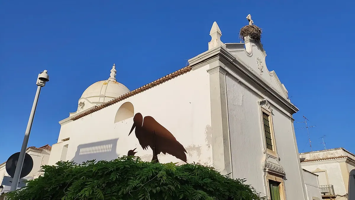 Dome and pale façade of Igreja de Nossa Senhora da Soledade in Olhão