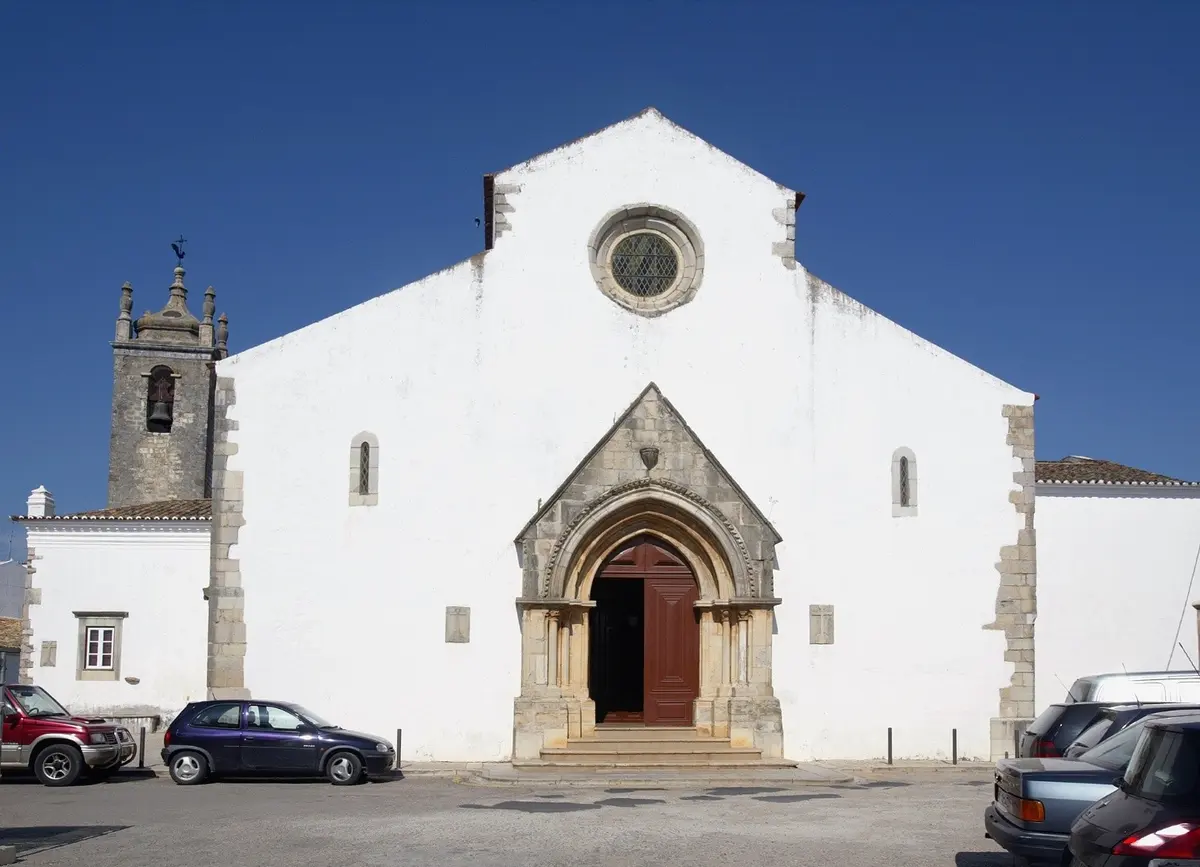 The Gothic entrance and bell tower of São Clemente church in Loulé