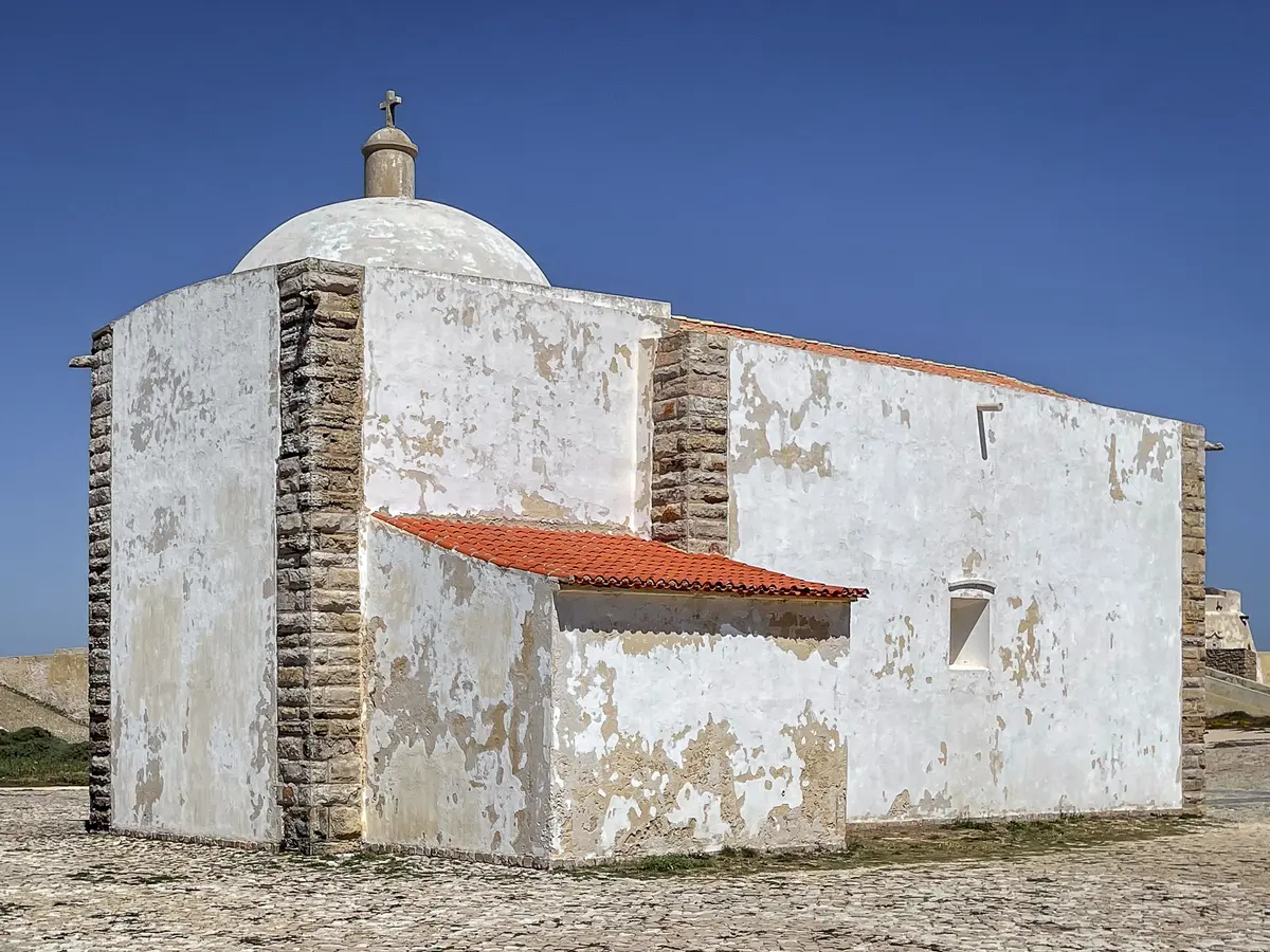 The simple white church of Nossa Senhora da Graça within the Sagres fortress complex