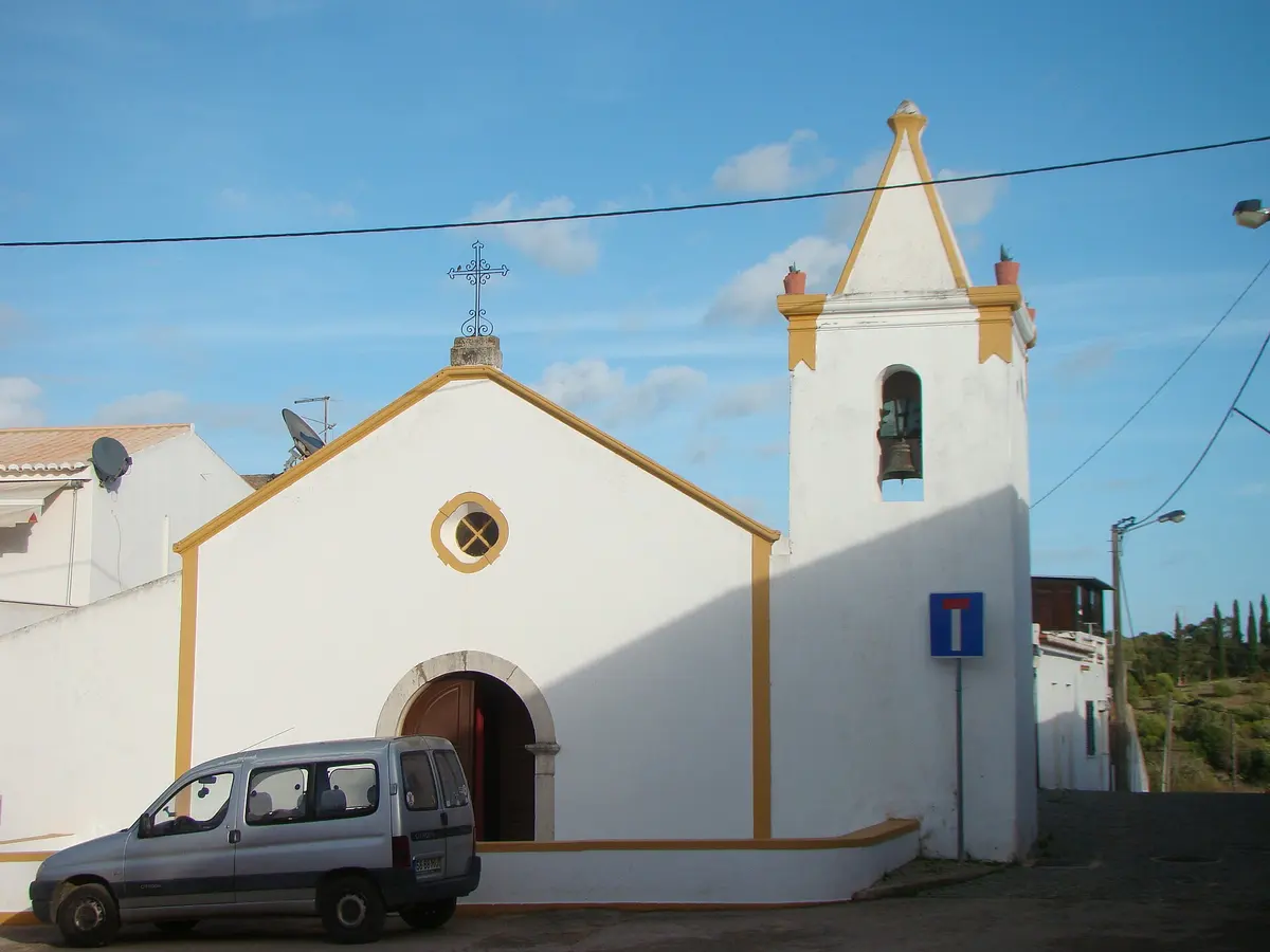 The blue-trimmed parish church and bell tower in Barão de São Miguel