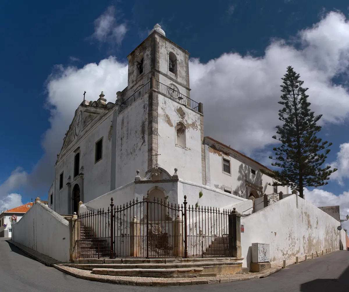 The white façade and bell tower of São Sebastião church in Lagos