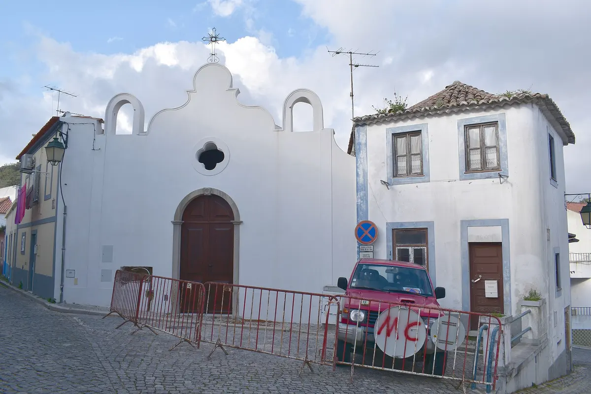 The small curved façade and twin bell gables of Senhor dos Passos chapel