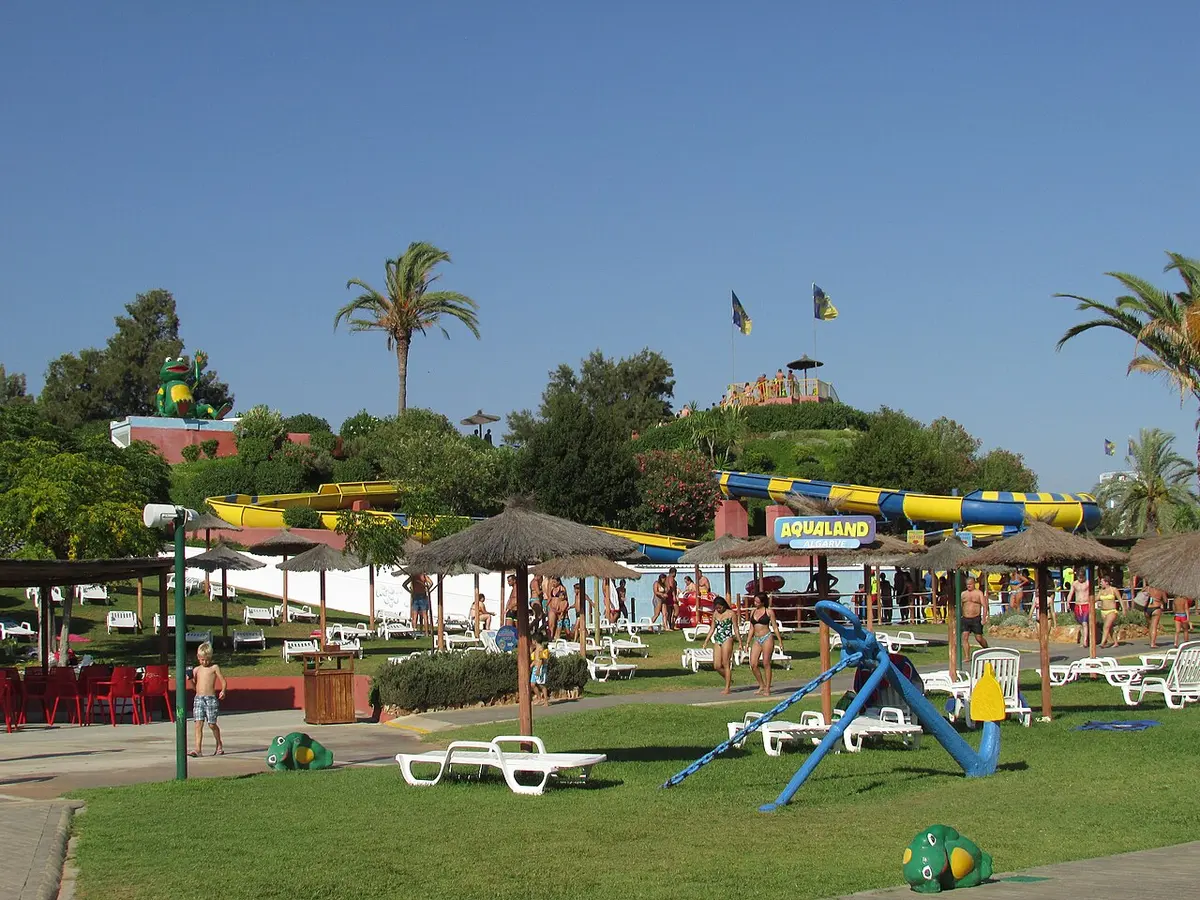 Lawn, poolside seating and water slides at Aqualand Algarve in Alcantarilha