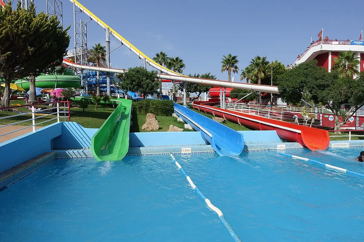 Colourful slides and a blue pool at Aquashow Park near Quarteira