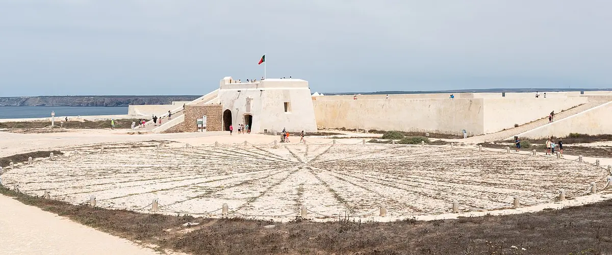 Stone Rosa dos Ventos and fortress gateway inside Fortaleza de Sagres