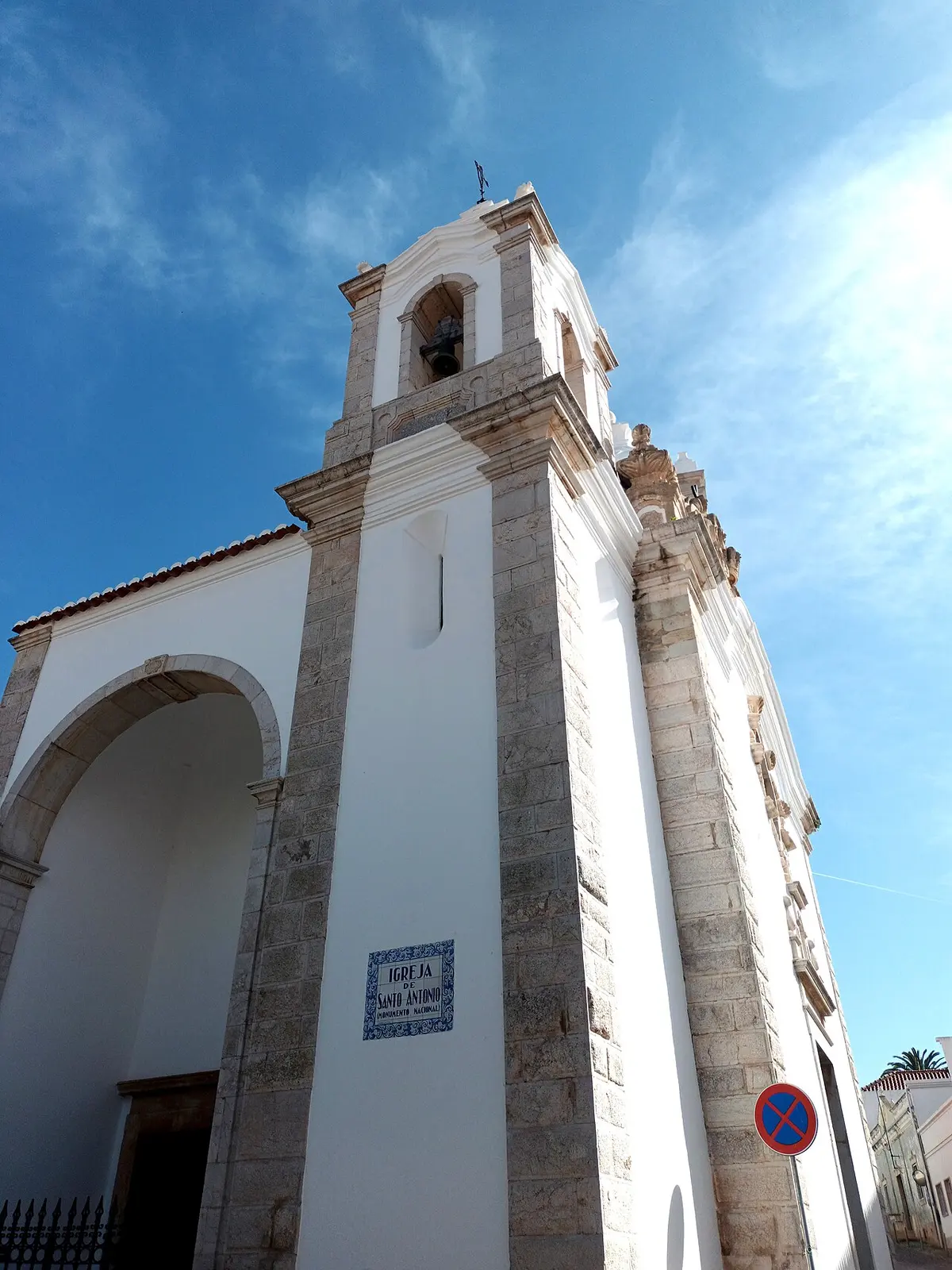 Bell tower and stone-framed entrance of Santo António church, part of the Museu de Lagos visit