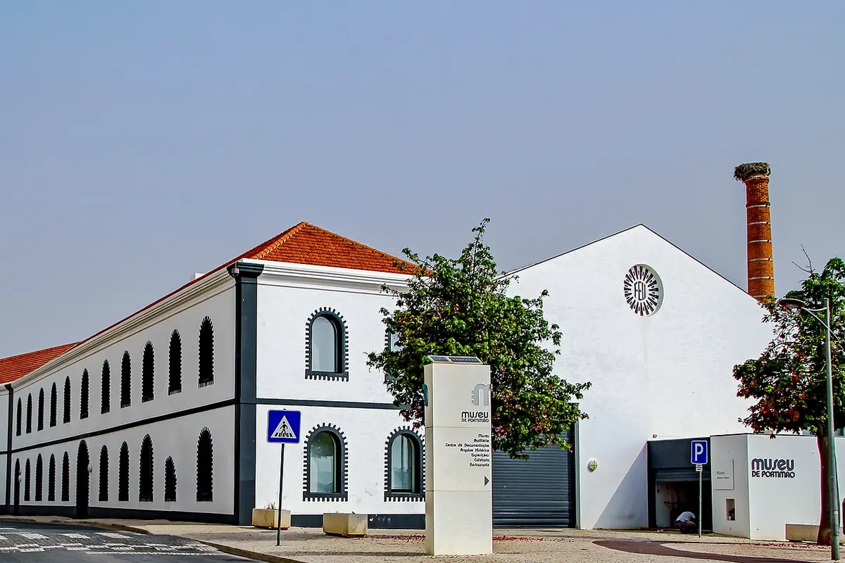 White former canning-factory building and chimney of Museu de Portimão