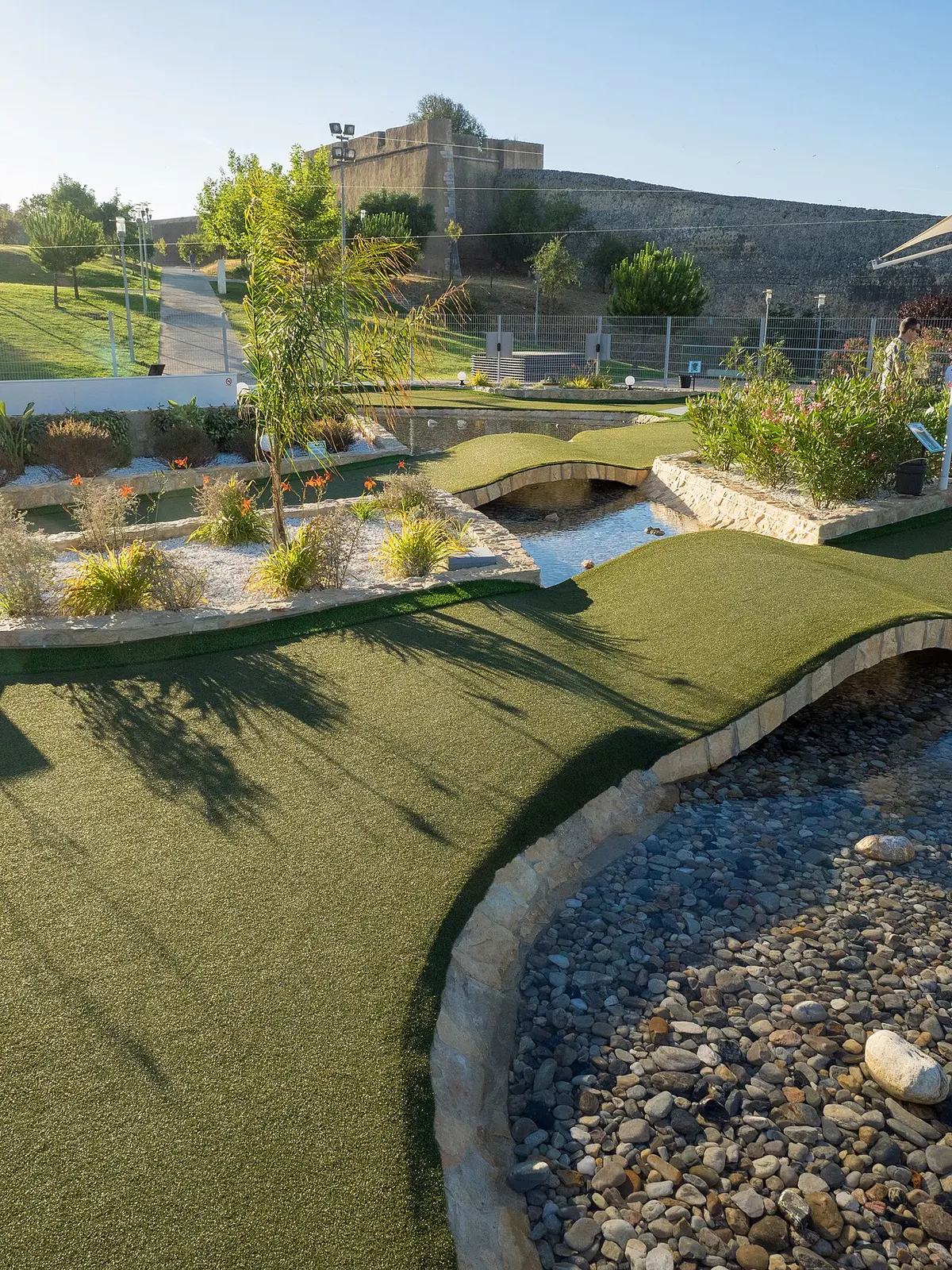 Mini golf greens, stone-edged water features and landscaped planting at Pro Putting Garden in Lagos