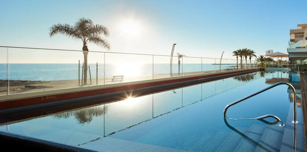 Dom José Beach Hotel’s pool terrace beside Quarteira’s beachfront promenade