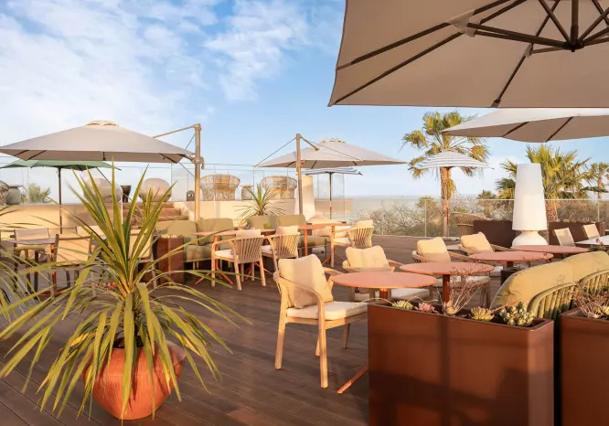 The shaded rooftop lounge terrace at Kimpton Atlântico Algarve