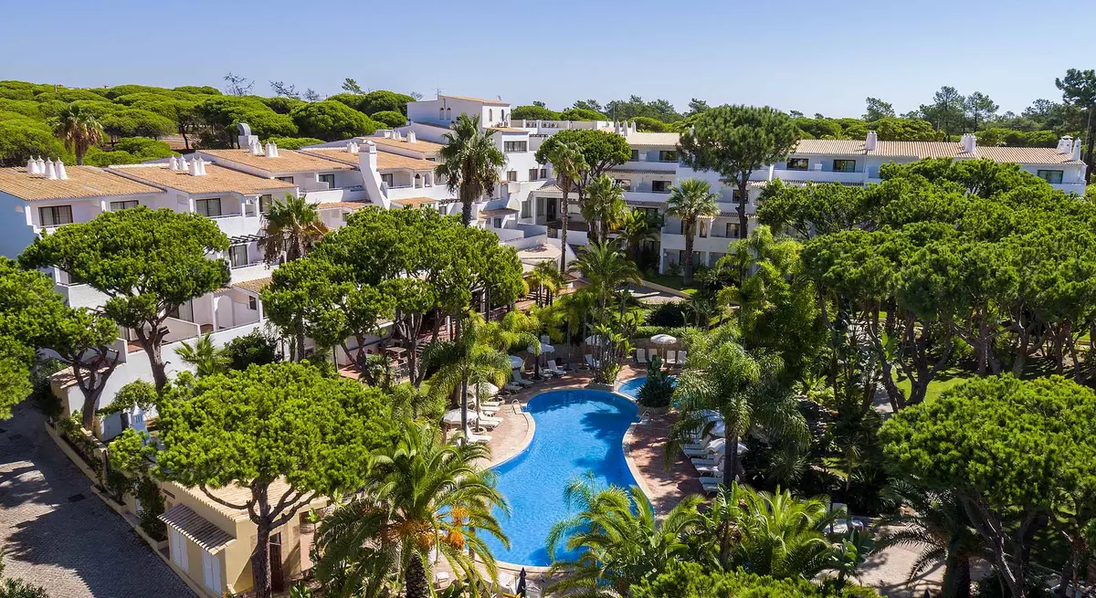 An aerial view of Ria Park Garden Hotel and its tree-lined swimming pool