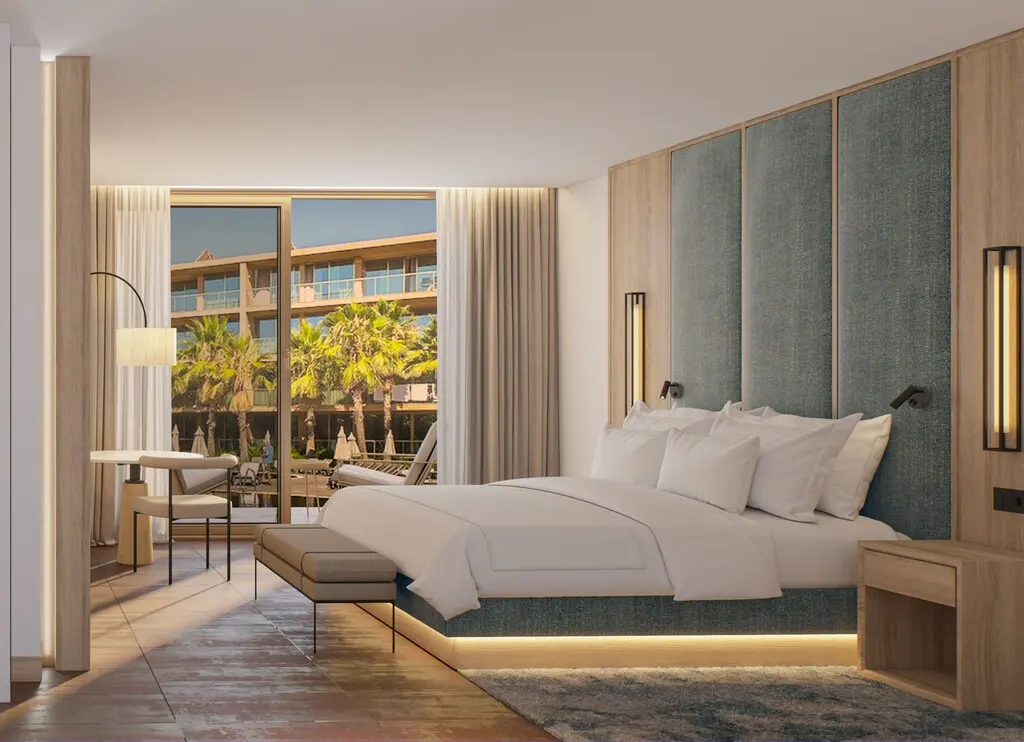 A bright guest suite and balcony at Algarve Marriott Salgados Golf Resort and Spa