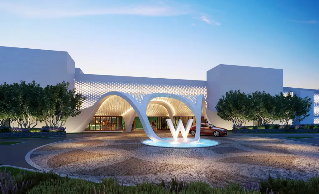 The illuminated W sculpture and sculptural white entrance of W Algarve