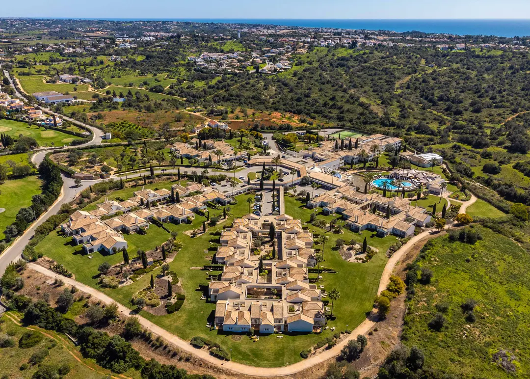 An aerial view of Vale d’Oliveiras buildings, pool and landscaped grounds near Gramacho
