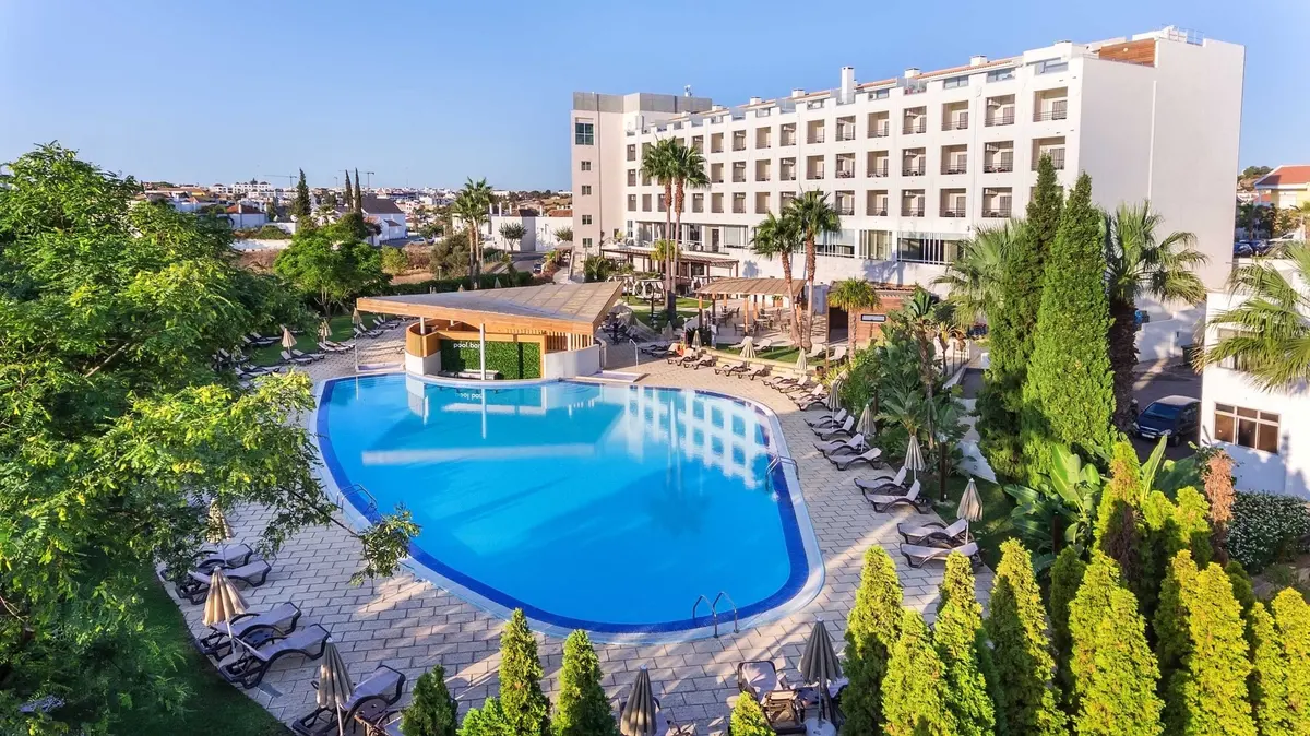 Outdoor pool and hotel building at AP Maria Nova Lounge in Tavira