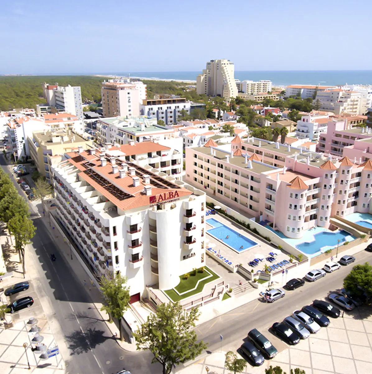 Hotel Alba buildings and outdoor pool seen from above in Monte Gordo