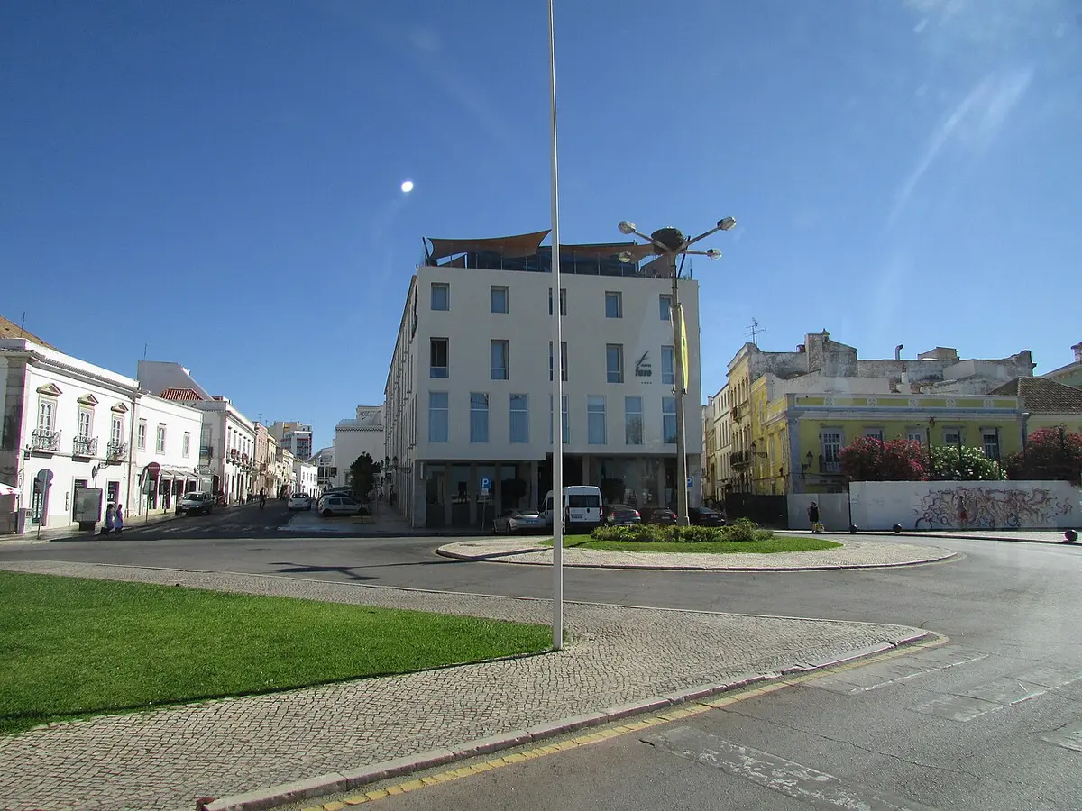 The waterfront hotel building beside Jardim Manuel Bivar in Faro