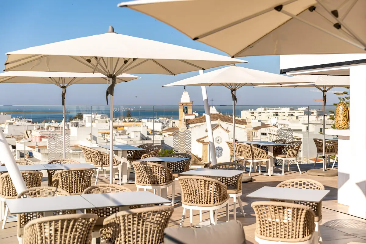 Shaded rooftop tables overlooking Olhão at Pure Formosa Concept Hotel