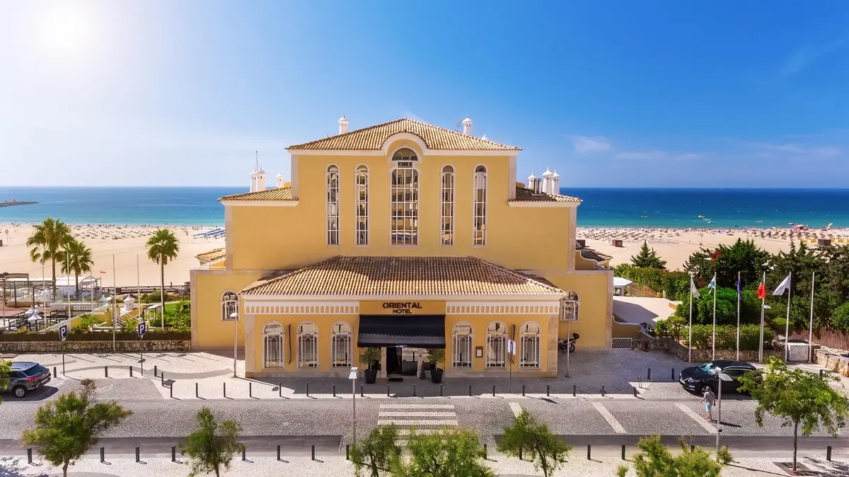 The distinctive façade of AP Oriental Beach with the sea behind
