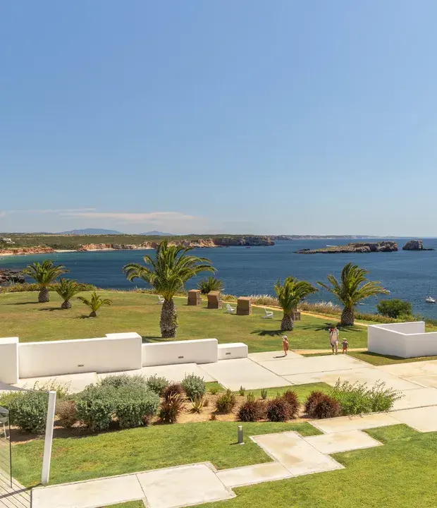 The hotel’s terraced gardens and outdoor seating overlooking the coast at memmo Baleeira