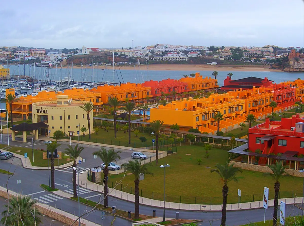 The colourful accommodation buildings beside the marina, photographed under the former Tivoli Marina Portimão name