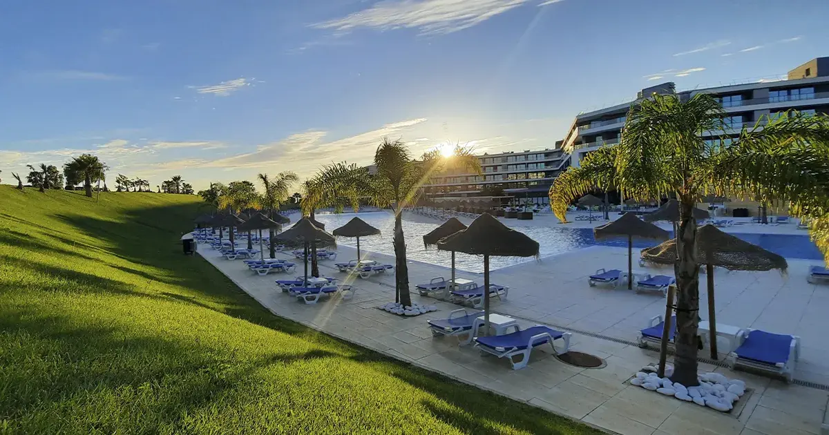 RR Alvor Baía Resort beside its landscaped pool and garden areas