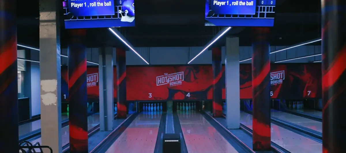 Bowling lanes and overhead score screens at Hotshot in Albufeira Marina
