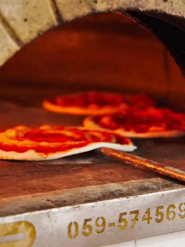 Pizza baking in Bellavita’s wood-fired oven near Galé