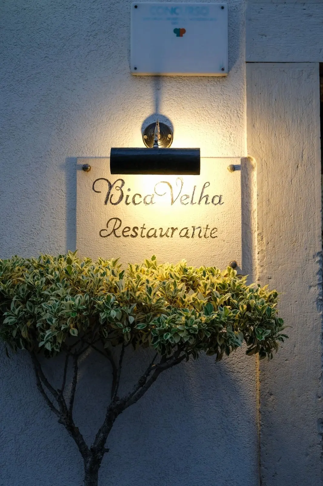 Bica Velha restaurant sign and exterior wall in Loulé