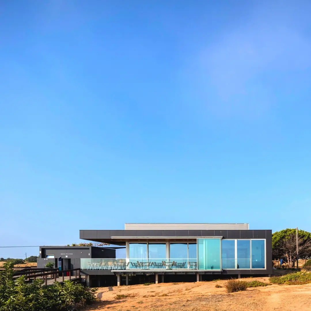 The modern Camilo restaurant building above the Lagos coast