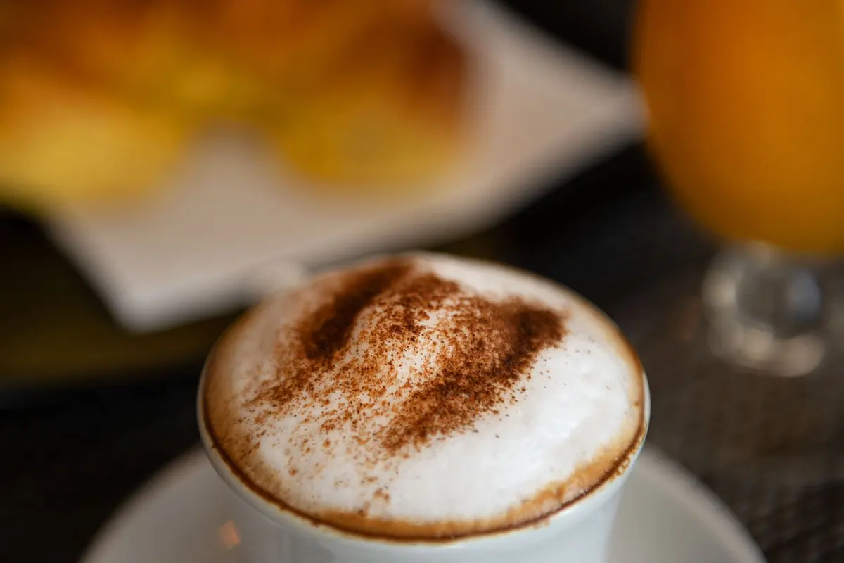 Close view of a foamy coffee from D’Maria’s own food gallery