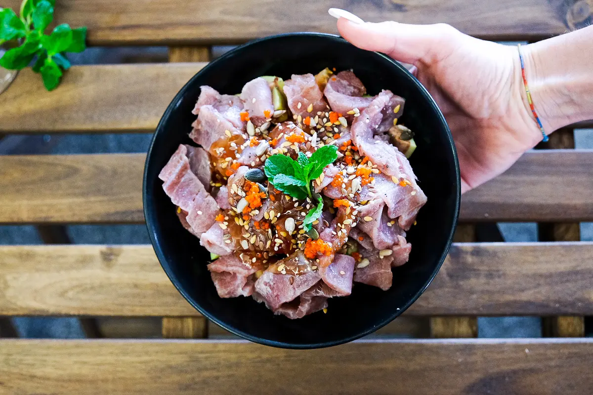A black bowl of tuna ceviche salad from 351 Eddy Tapas’ official dish-suggestions gallery.