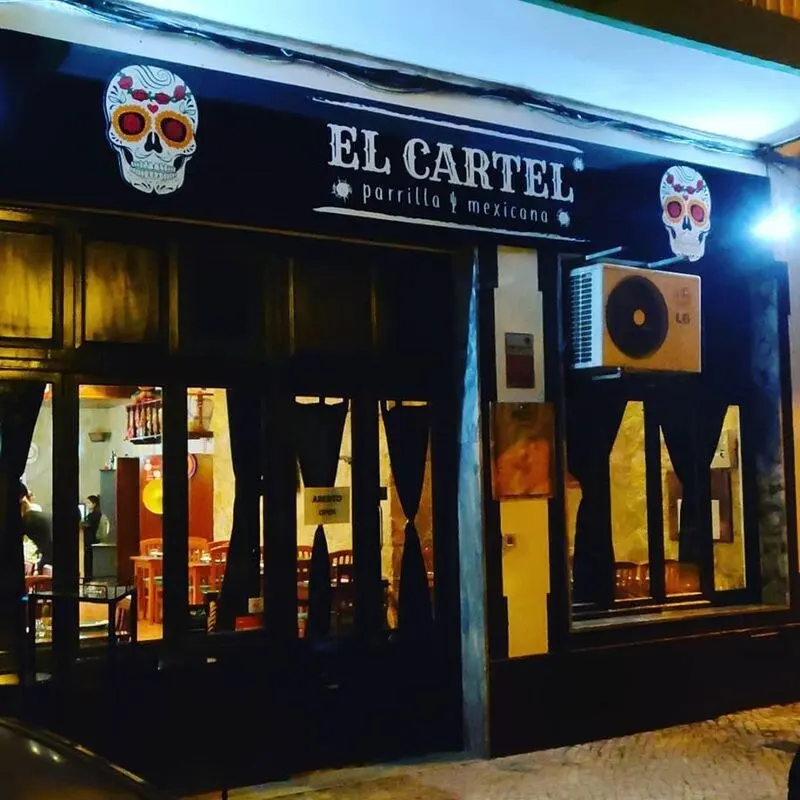 Illuminated entrance to El Cartel in Loulé