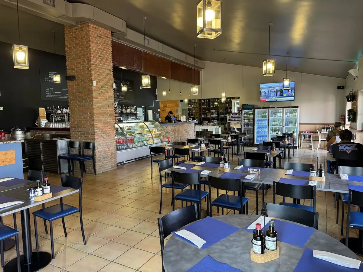 Dining tables, shelving and a drinks counter inside Fonte do Vale