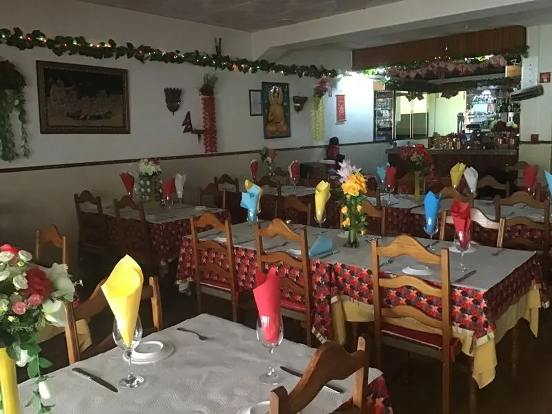 Tables laid with coloured napkins in Maharaja Patiala’s Monte Gordo dining room.