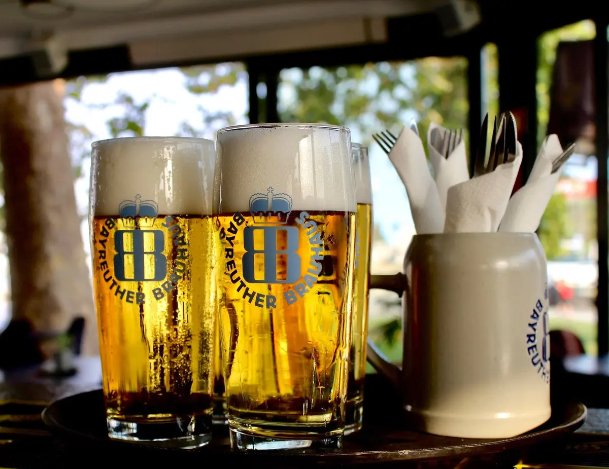 Glasses of beer and cutlery on a table in Munich Lagos