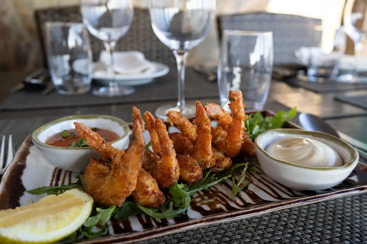 Breaded prawns with lemon and dipping sauces at O Paulo